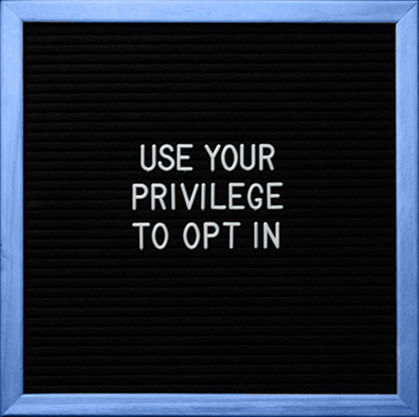 Sign saying "Use your privilege to opt in"