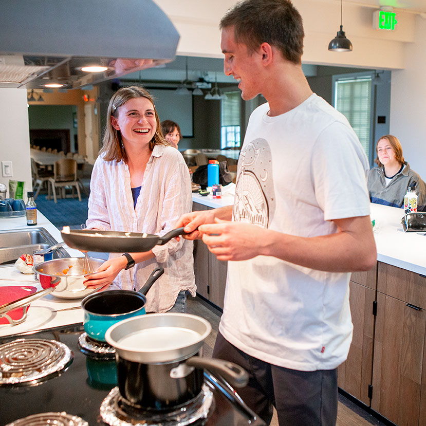 Two students cook in the Lyman kitchen