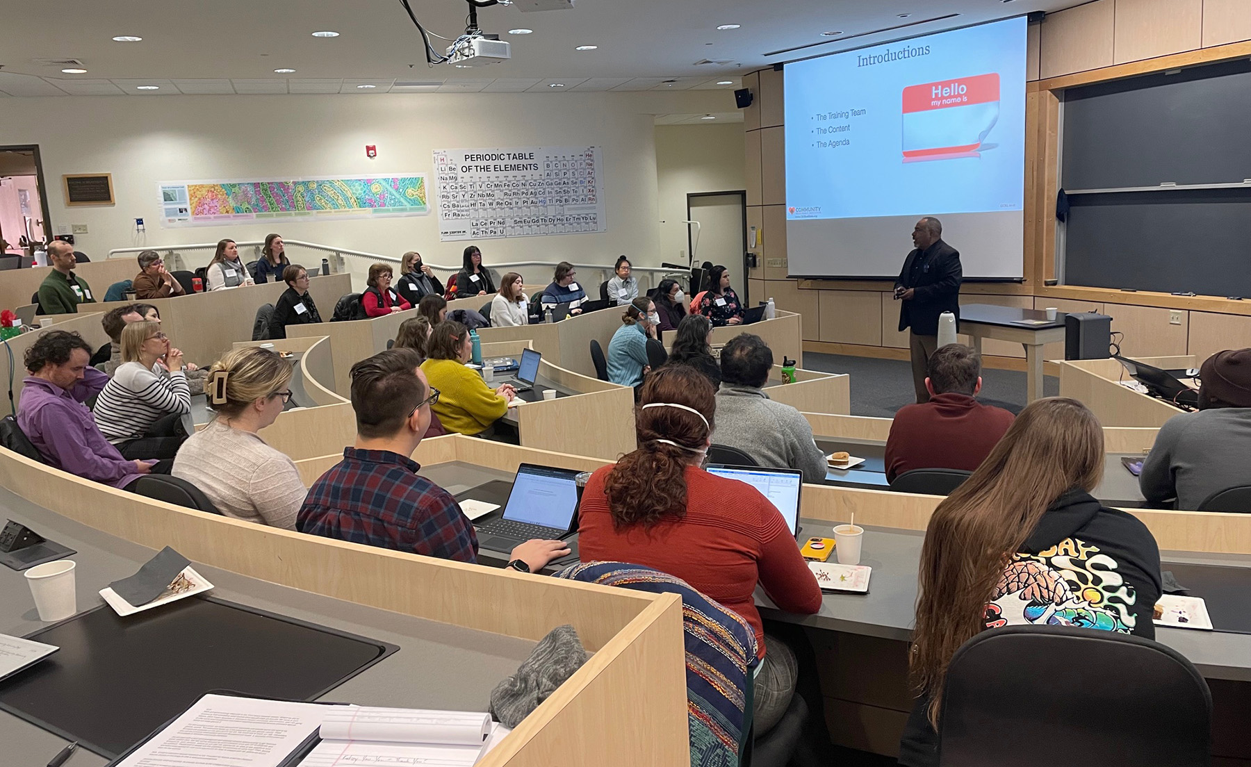 Rick Griffin addresses an audience of Whitman faculty and staff members in a classroom setting.