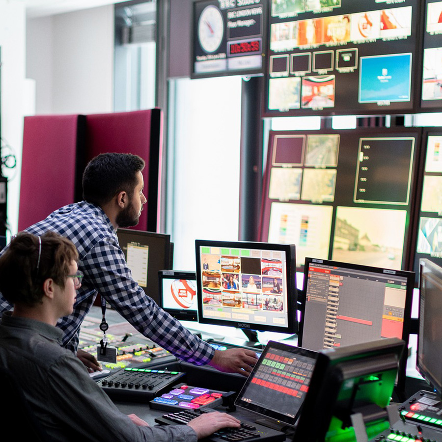 Two individual in a production studio.