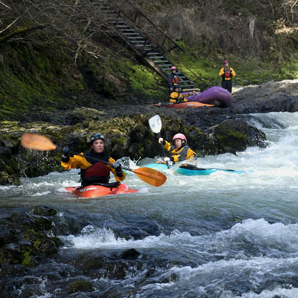 Whitman College students navigating river currents.