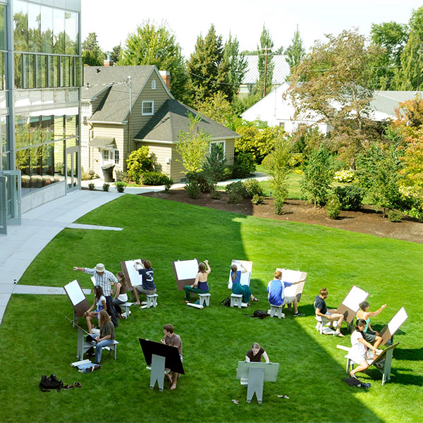 Whitman College students working on art projects outside.