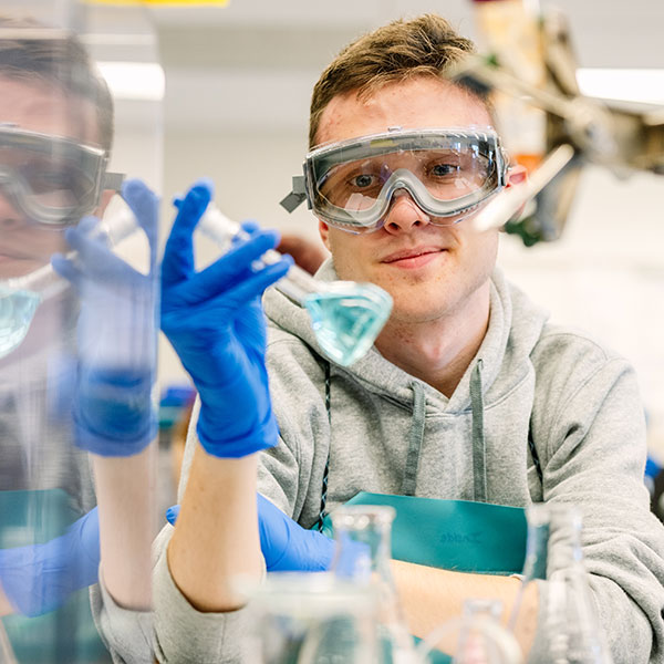 Whitman College student working in a lab.