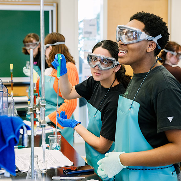 Whitman College student conducting a chemistry experiment.