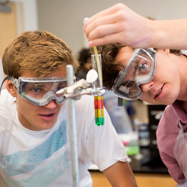 Two Whitman College students working on a chemistry project.