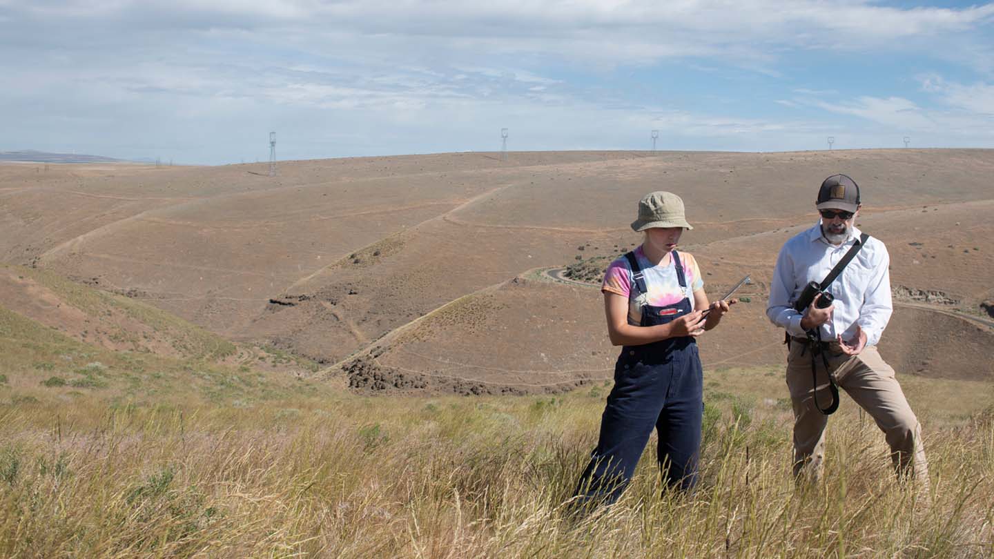 Student with Professor Tim Parker at the Braden Ranch doing field research.