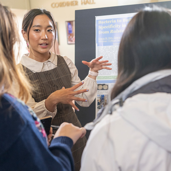 Student presenting their research poster during The Whitman Undergraduate Conference