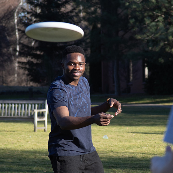 Patrick Mulikuza throwing a Frisbee