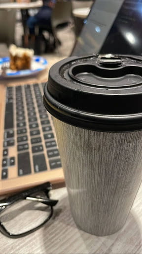 Coffee cup on a desk.