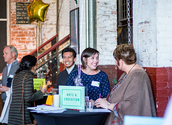 Group of alumni Whitties conversating at a networking event.