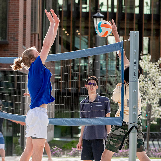 Students play volleyball