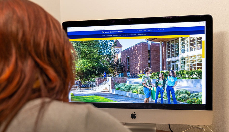 Madeline Langdon looking at the Whitman College website.