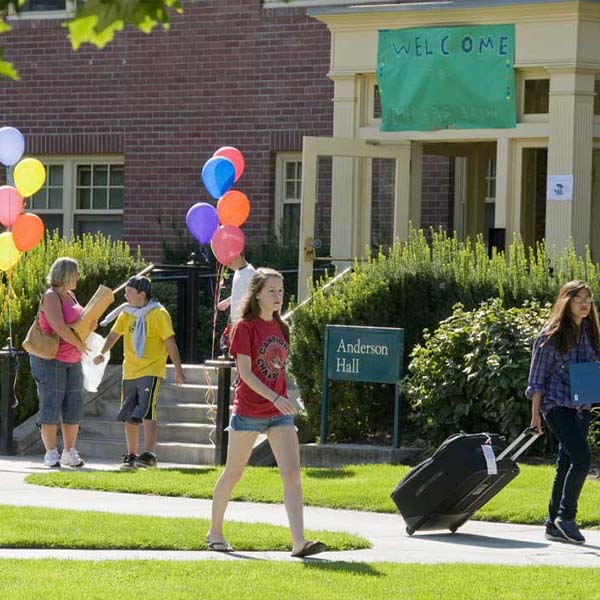 Students moving into their rooms.