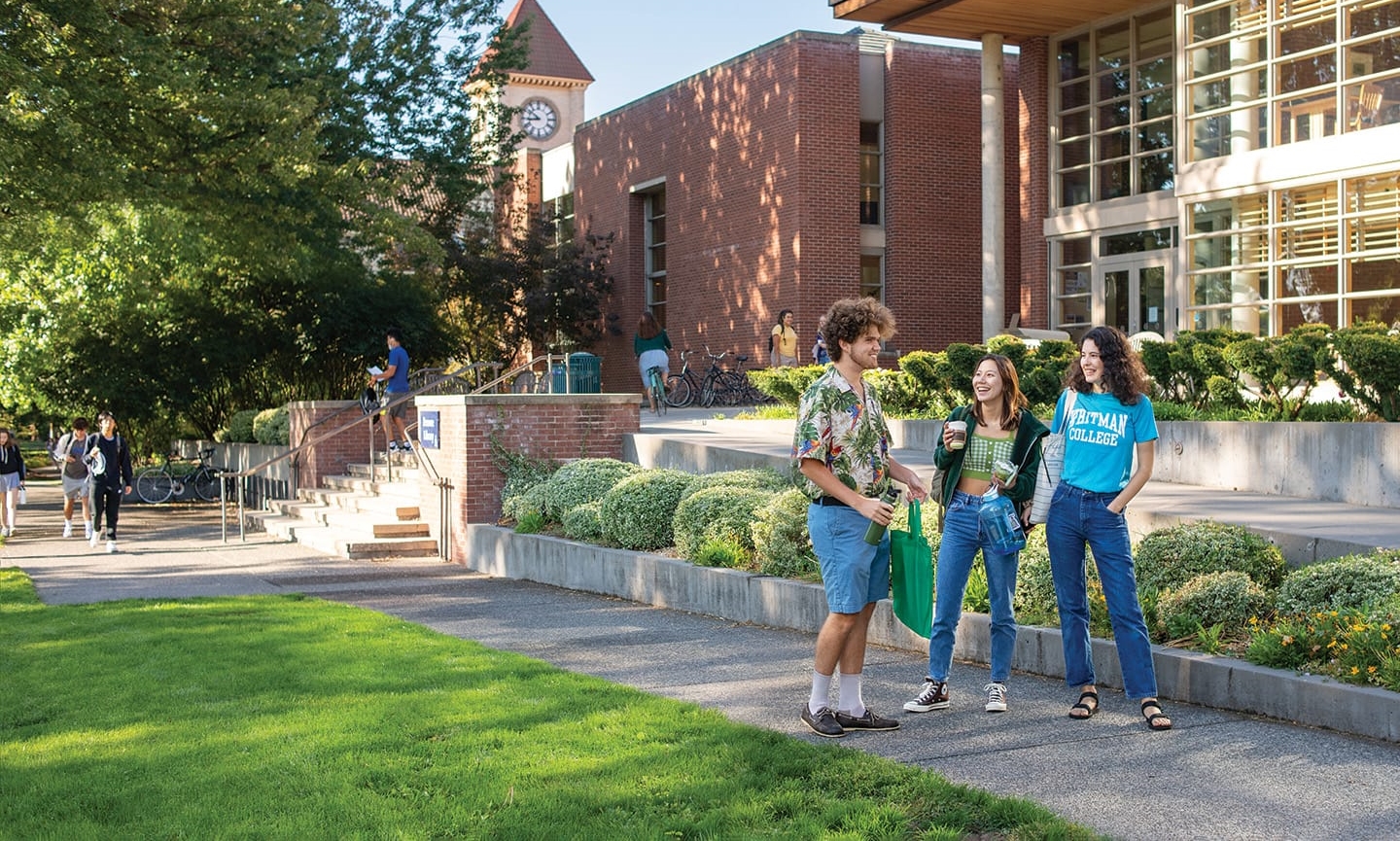 Student talking outside Penrose Library on Ankeny Field