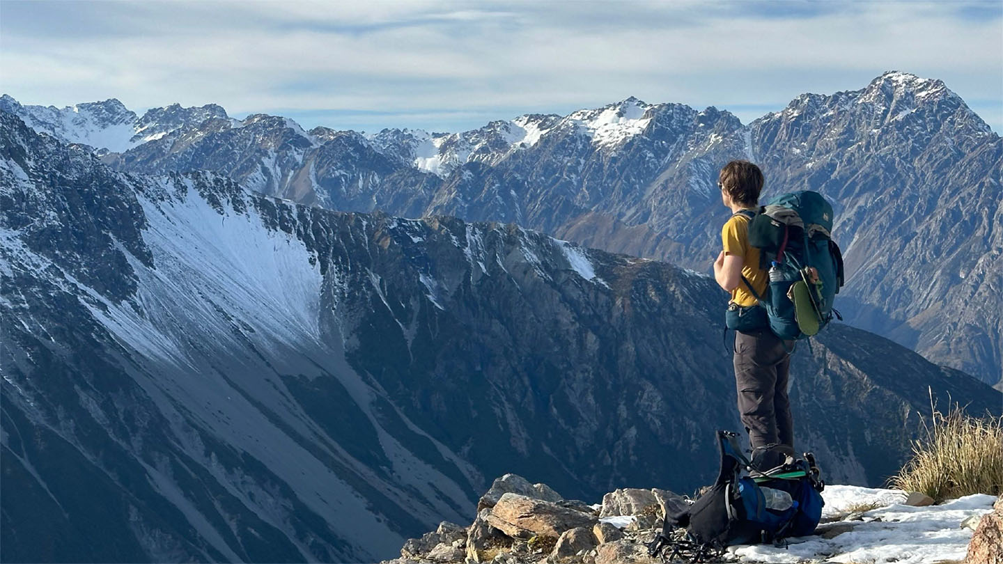 Whitman student viewing a vista of mountains in the background