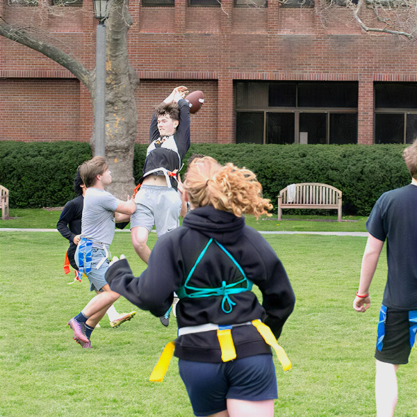 Whitman College students playing Intramural flagged football.