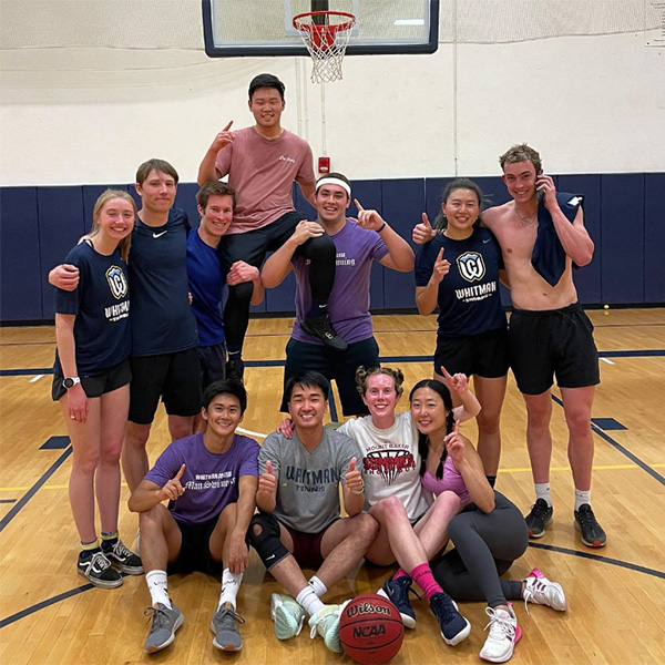 Whitman College students participating in intramural basketball.