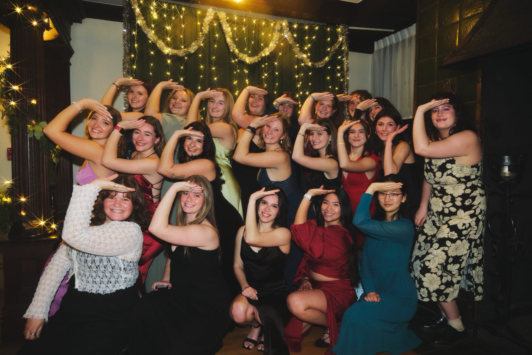 a large group of sorority members at a formal event