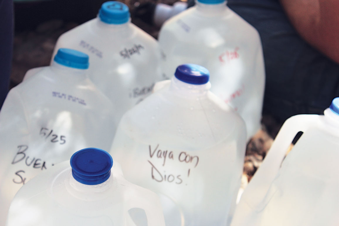 Water bottles with positive messages written on them.