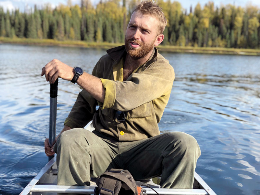 Sam Perkins '17 paddling a canoe