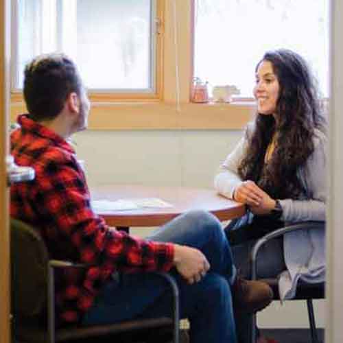 Mitzy Rodriguez Camiro, a career coach, speaks with a student