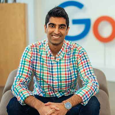 Al Rahim Merali sitting in front of a Google sign