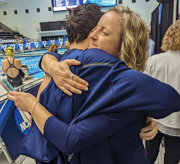 Tanner hugging his coach after a swim meet.