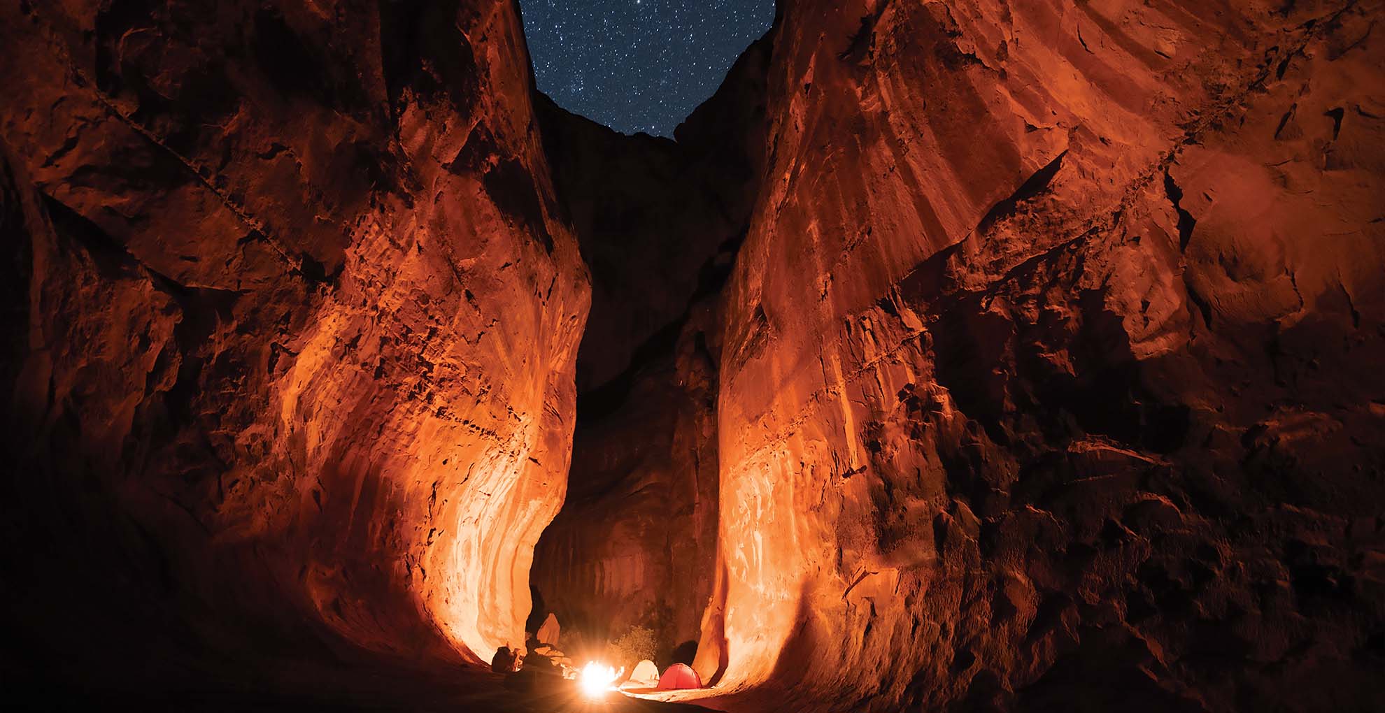 Campsite inside a cavern at night.