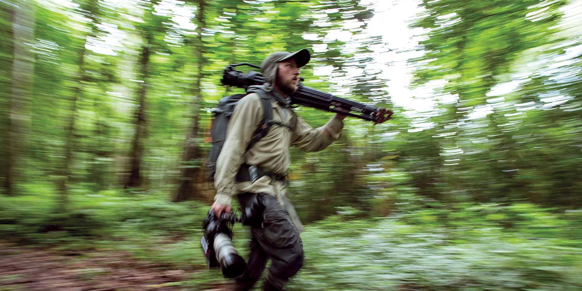 Rick Smith hikes through the jungle.