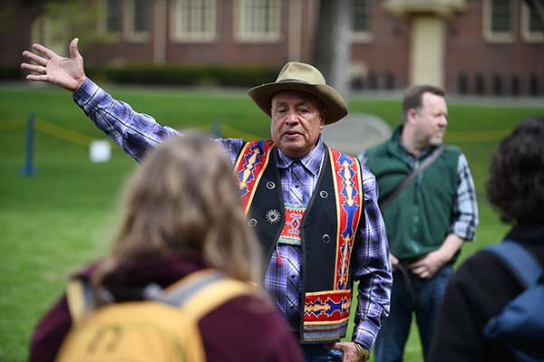 Roger Amerman welcomes visitors outside the long tent. 