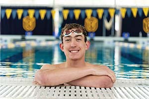 Tanner Filion ’23 smiling in the pool.