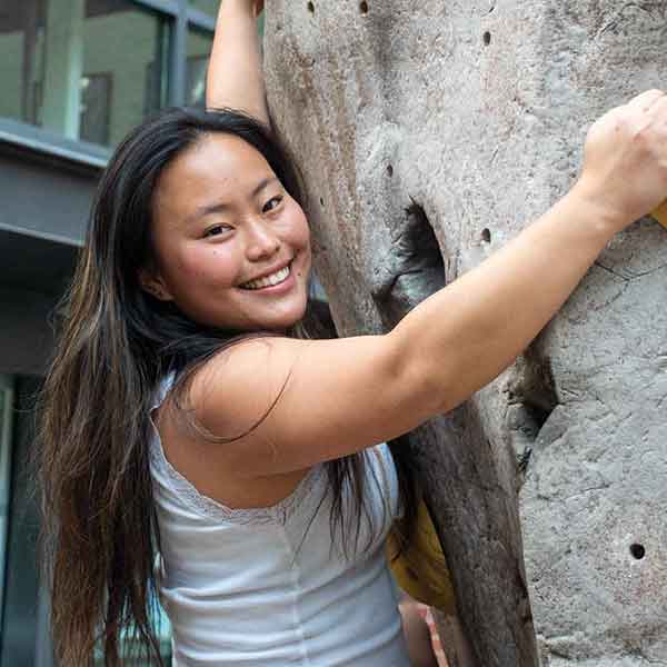 Wako Soma on Whitman's climbing wall.