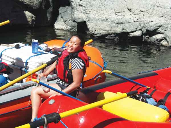 Wako Soma smiling from a river raft