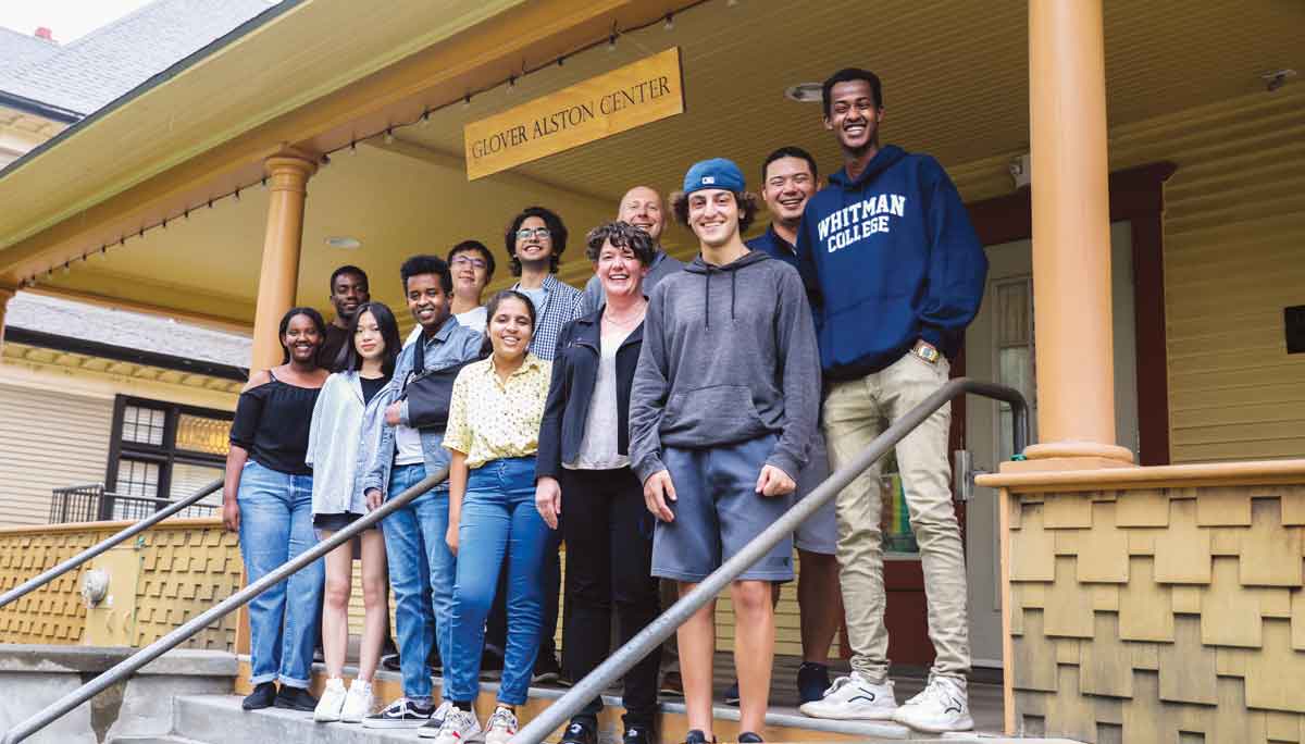 The reunited students smiling outside the Glover Alston Center.