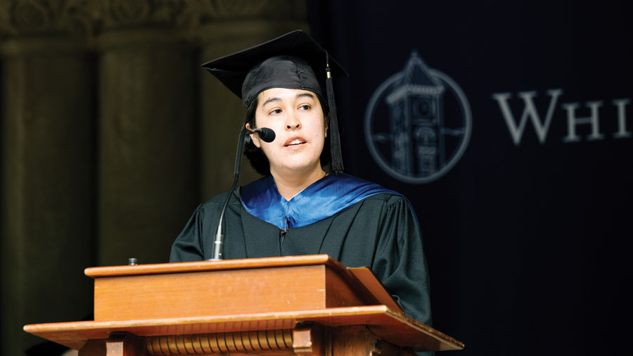 Amber Ebarb speaking from a podium.