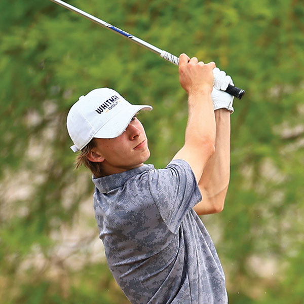 Mason Remington swinging a golf club.