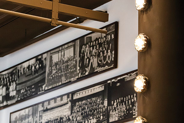 Old photos framed on the wall of the Nippon Kan Theatre.