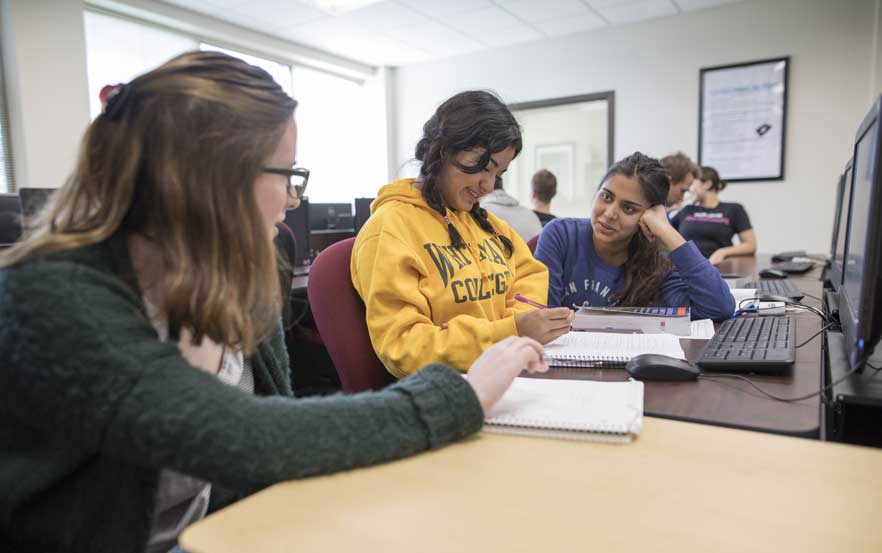 Students discuss computer science.