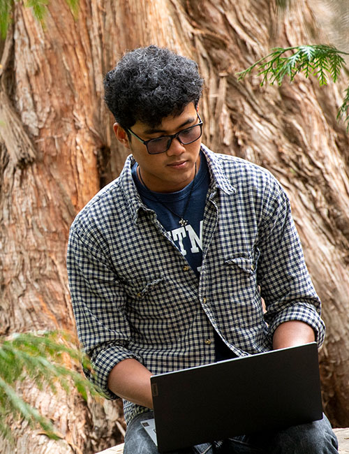 Student with a computer