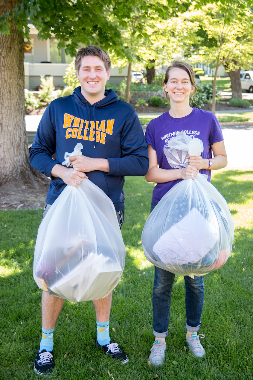 Adam Dawson '16, resident director of the interest house community, and Liz Clagett '15, resident director of Prentiss Hall, co-coordinators of this year's move-out week donation drive, display some of the provisions. Photo by Jake Barokas '18