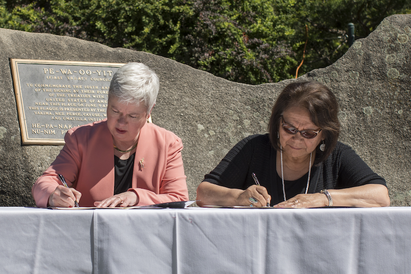 President Kathy Murray and Kathryn Brigham, secretary of the CTUIR Board of Trustees, sign the Memorandum of Understanding in June 2017.