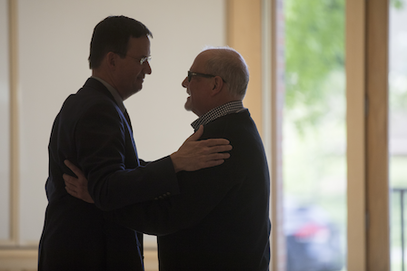 Cleveland and Peter Harvey '84, chief financial officer, share a private moment.