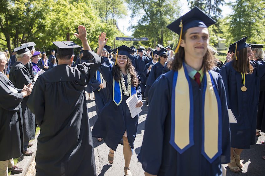 Biology major Stacie Bellairs '17 gets a high-five during the processional.