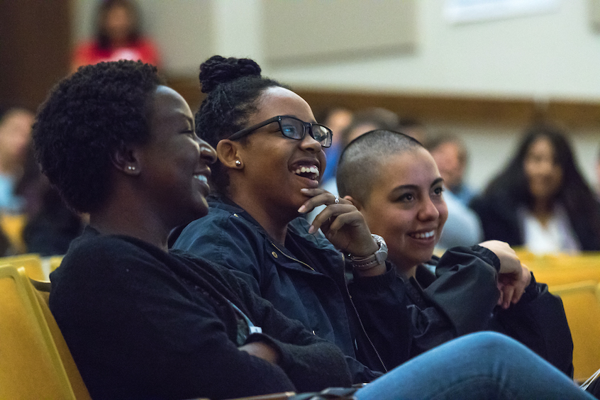 Left to right: Linfield College students Esther Parker, a nursing major; Jade Everage, a communications major, and Camila Arguello, an international relations and psychology major, respond to a story by keynote speaker Agard. “I’m looking to learn about ways to make students on campus uncomfortable because right now, they’re too comfortable,” Everage said before the event. “There are issues that we need to be able to discuss without shying away.”