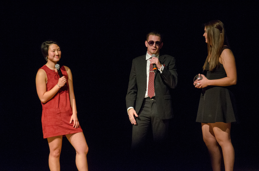 Emcees KC Cook '18 (left), a physics/pre-engineering major, and Rachael Haggen '18, a geology major, both members of Kappa Kappa Gamma, question contestant Court Osborn '18, a history major and Beta Theta Pi member.