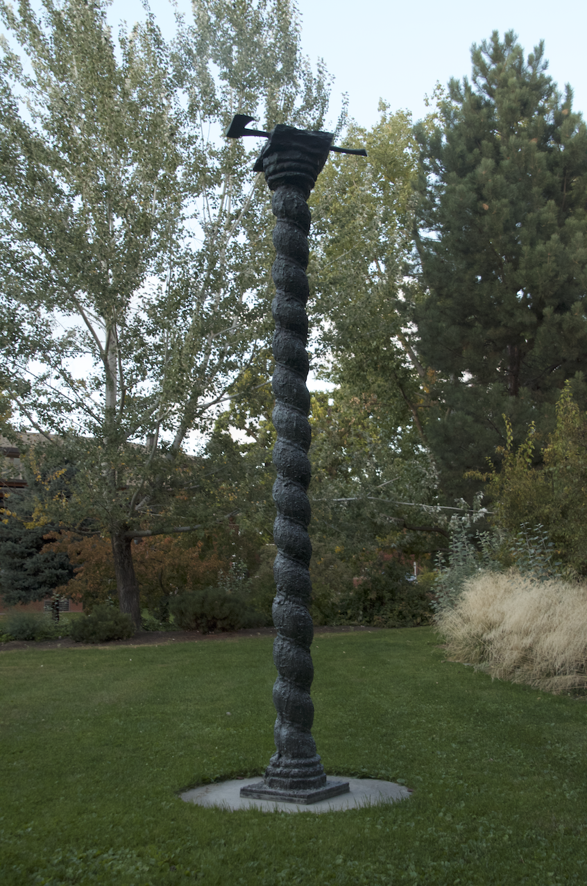 Column with Ax and Rock (1983), a 140" x 31" x 17" bronze sculpture cast as an edition of three, is currently located outside Fouts. 