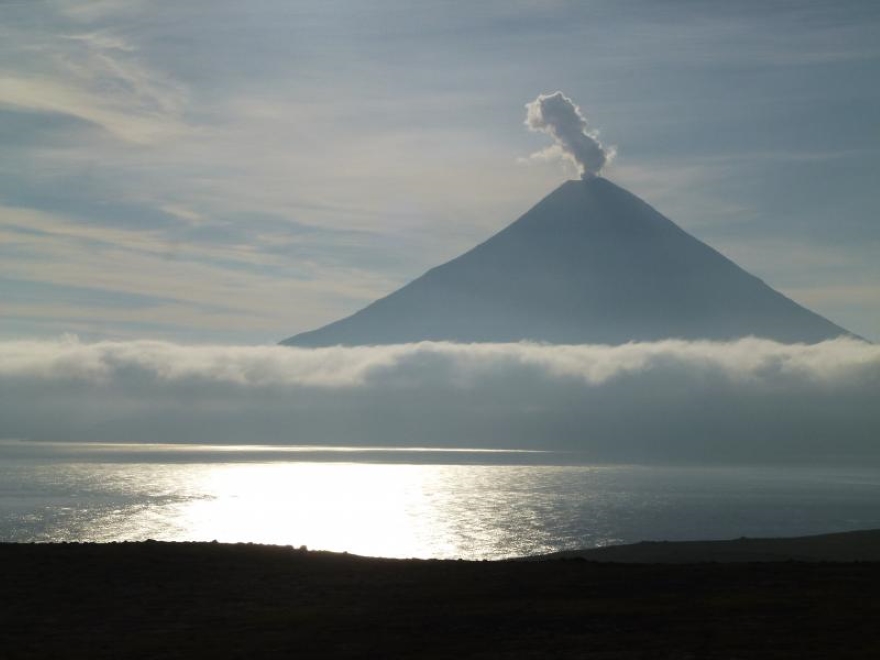 Mount Cleveland, a stratovolcano, is distinctively conical and symmetrical in form. It is the tallest volcano in the Four Mountains group. Photographed by John Lyons of the USGS. 