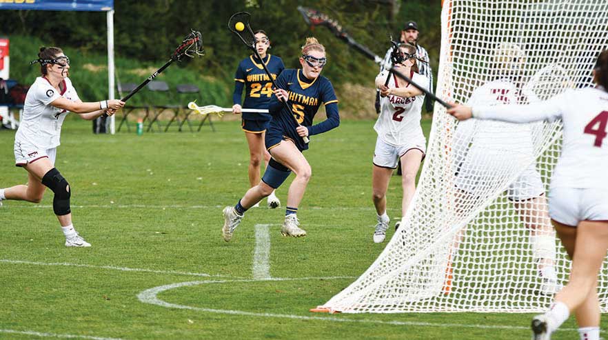 Whitman college lacrosse players competing against another team
