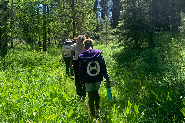Whitman students hiking on the Maxville site