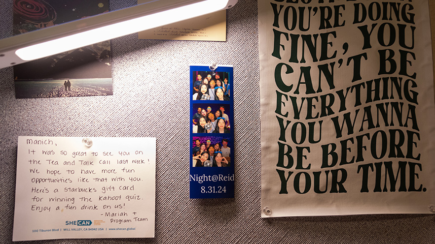 A pin board showcasing a photobooth images and a letter.